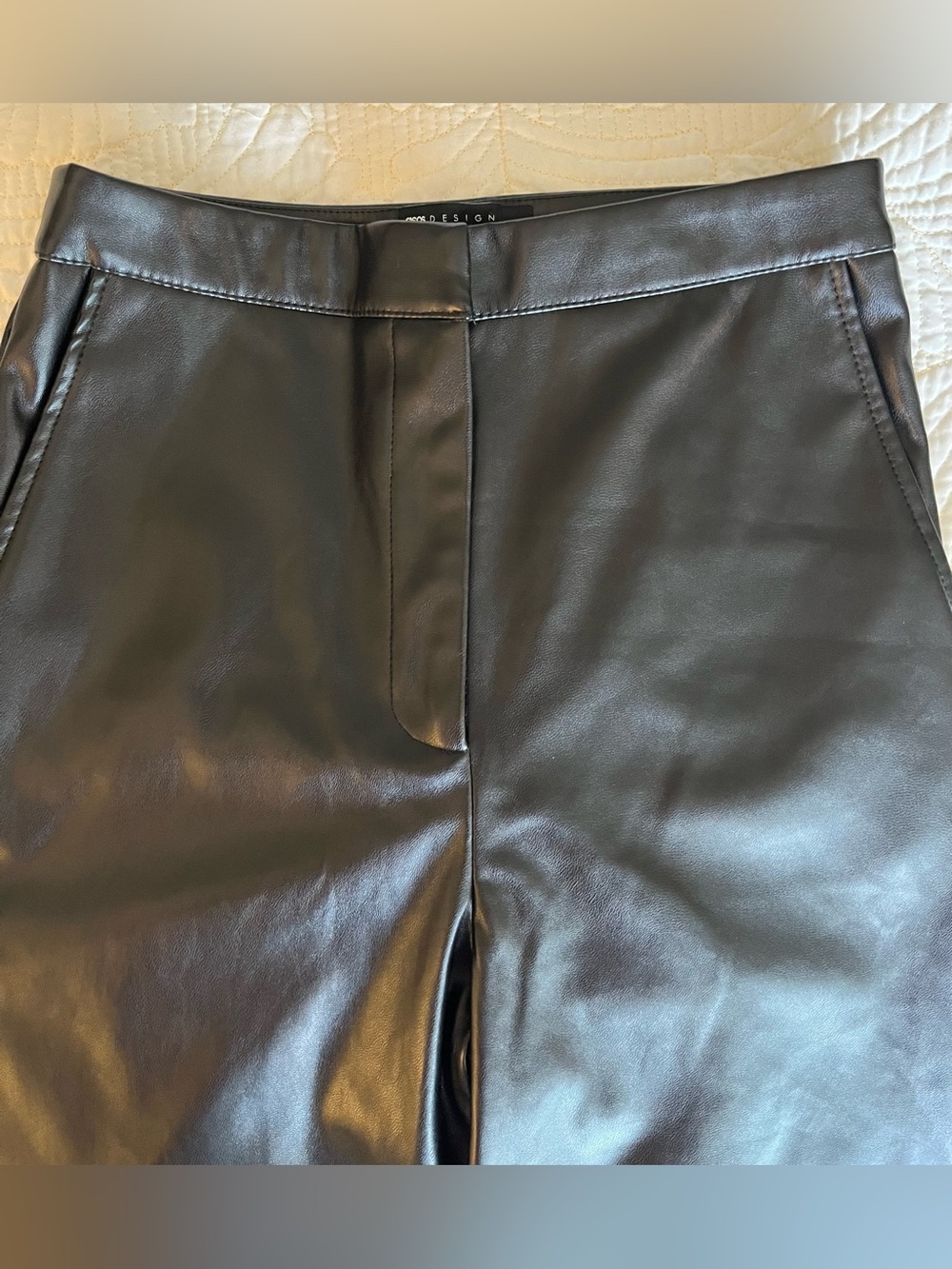 Faux leather pants. I bought and never used they are tall . Pristine condition